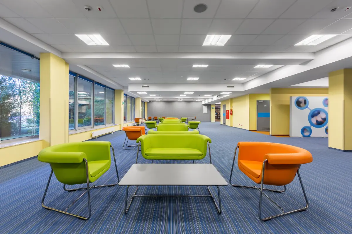 A room with several chairs and tables in it